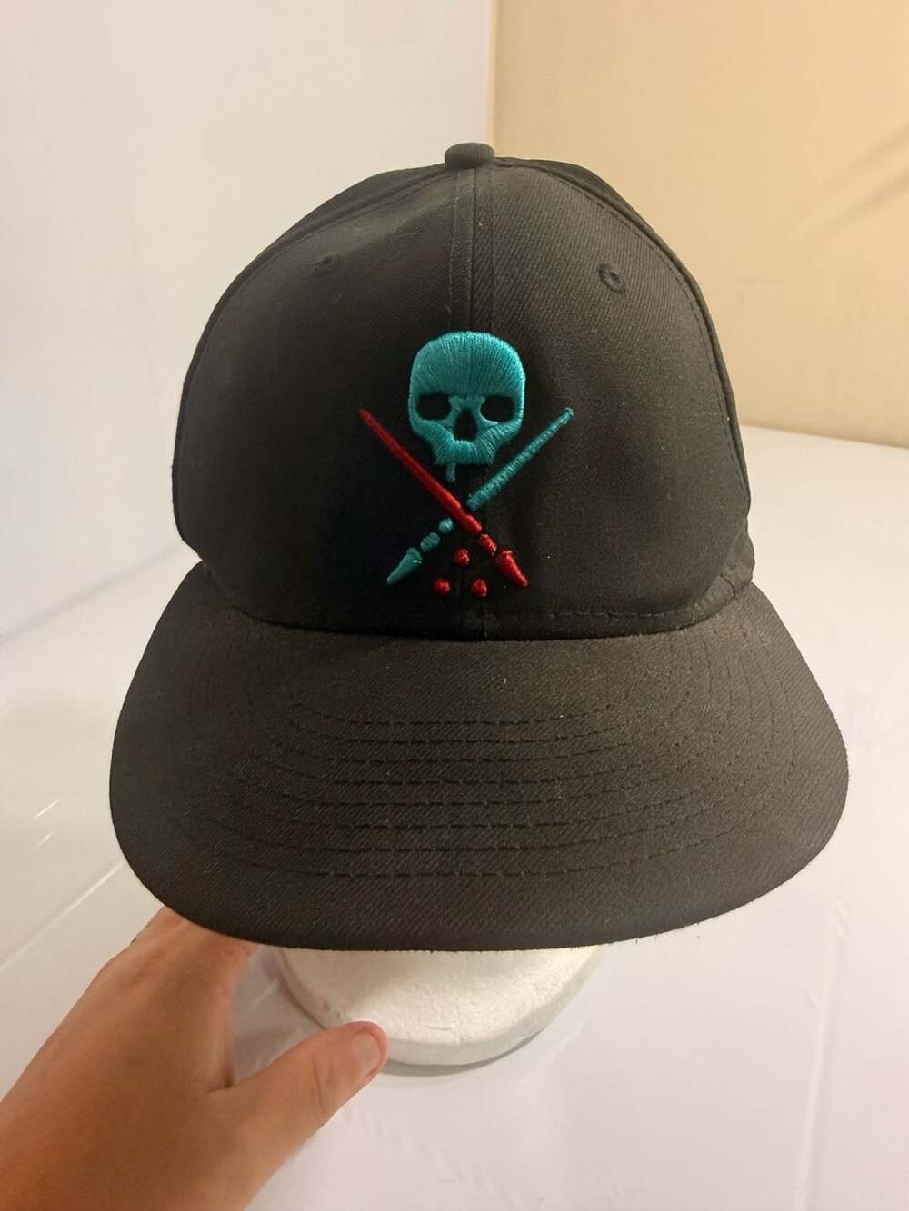 Sullen Art Collective Black Snapback Hat with Skull and Crossed Brushes Design